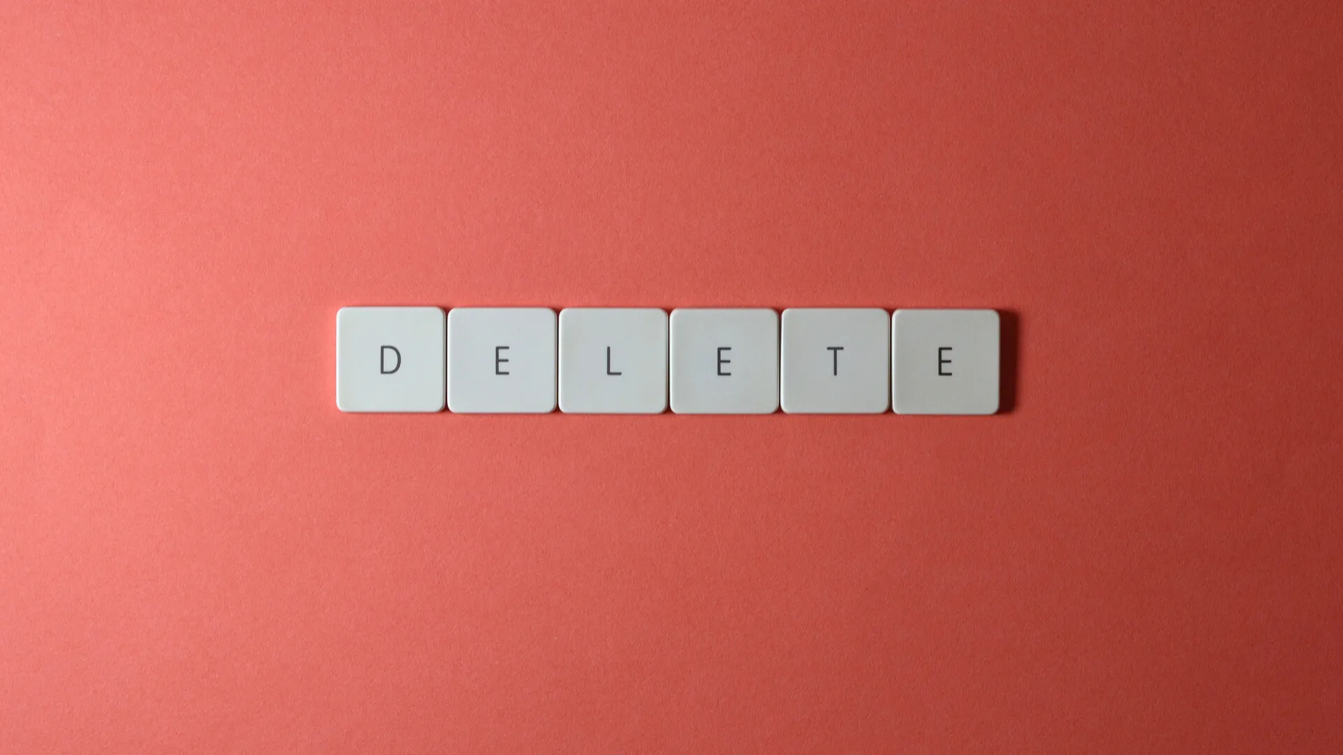 A slide with block letters that says, "delete"